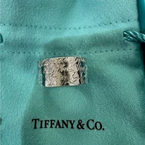 Tiffany & Co wide band silver ring.
